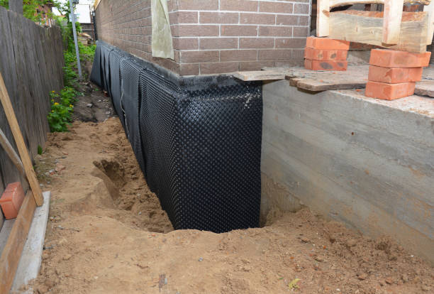 SJ Waterproofing Pros technician performing targeted Foundation Crack Repair assessment in Friendship, IN